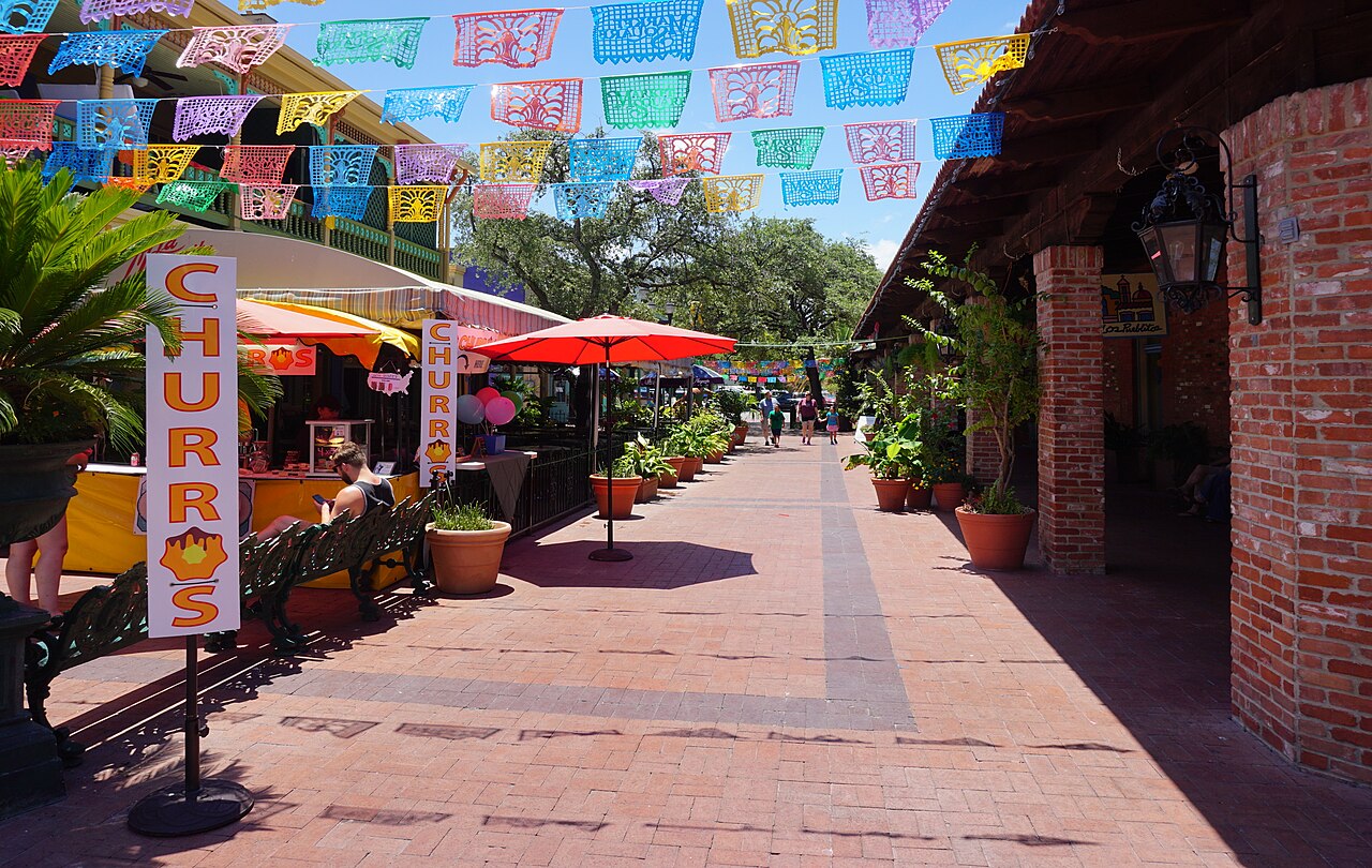 El Mercado / Market Square with papel picado and a churro stand